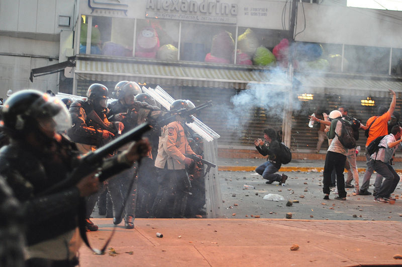 Tear_gas_used_against_protest_in_Altamira,_Caracas;_and_distressed_students_in_front_of_police_line.jpg